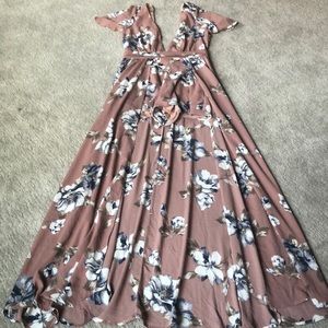 One piece outfit with flared skirt on the back